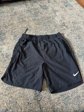 Nike Black Athletic Shorts with White Swoosh Logo